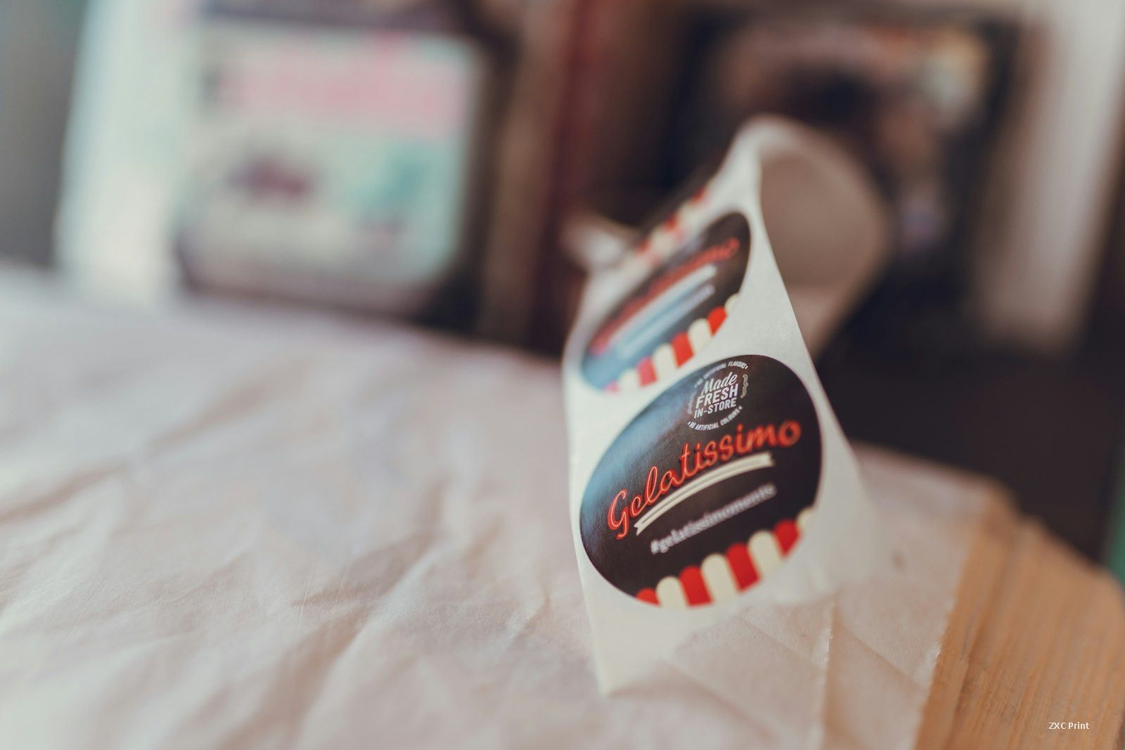 Roll of die-cut pressure-sensitive labels on a white liner