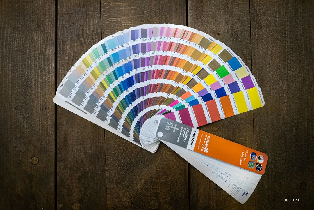 Pantone spot color swatch guide used for ink color matching in carton printing