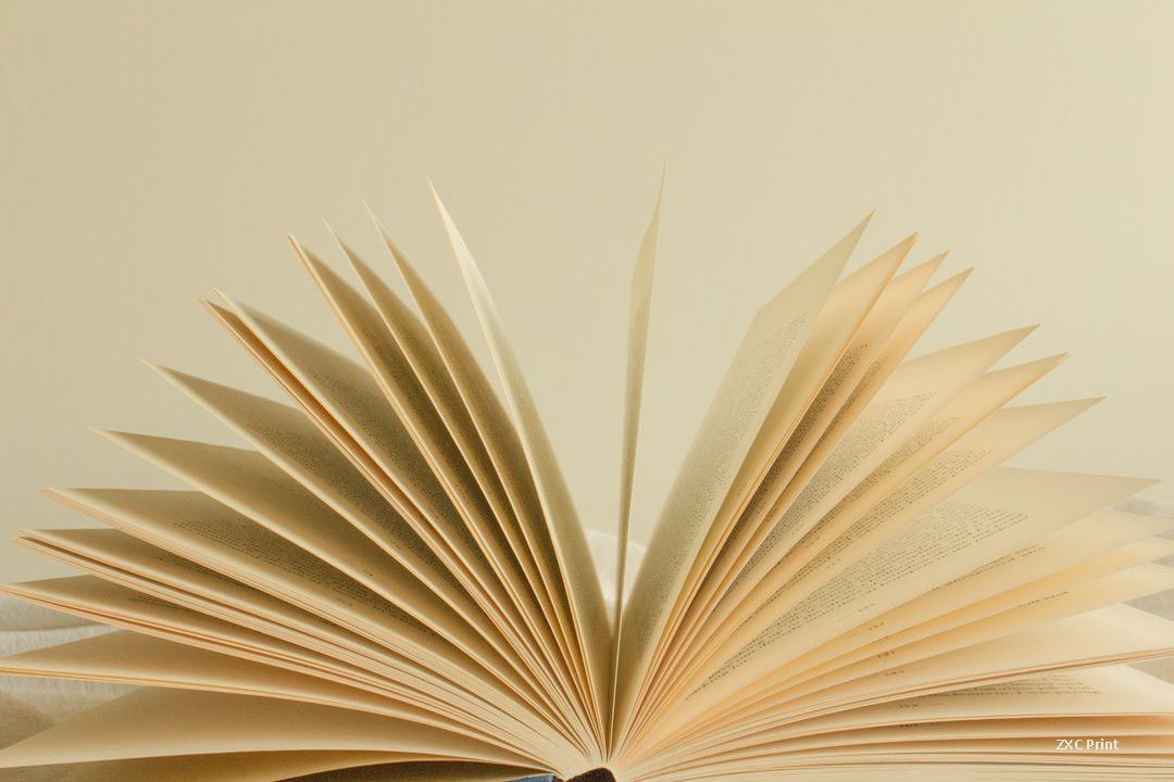 Open book with fanned pages showing the sequence of page numbers