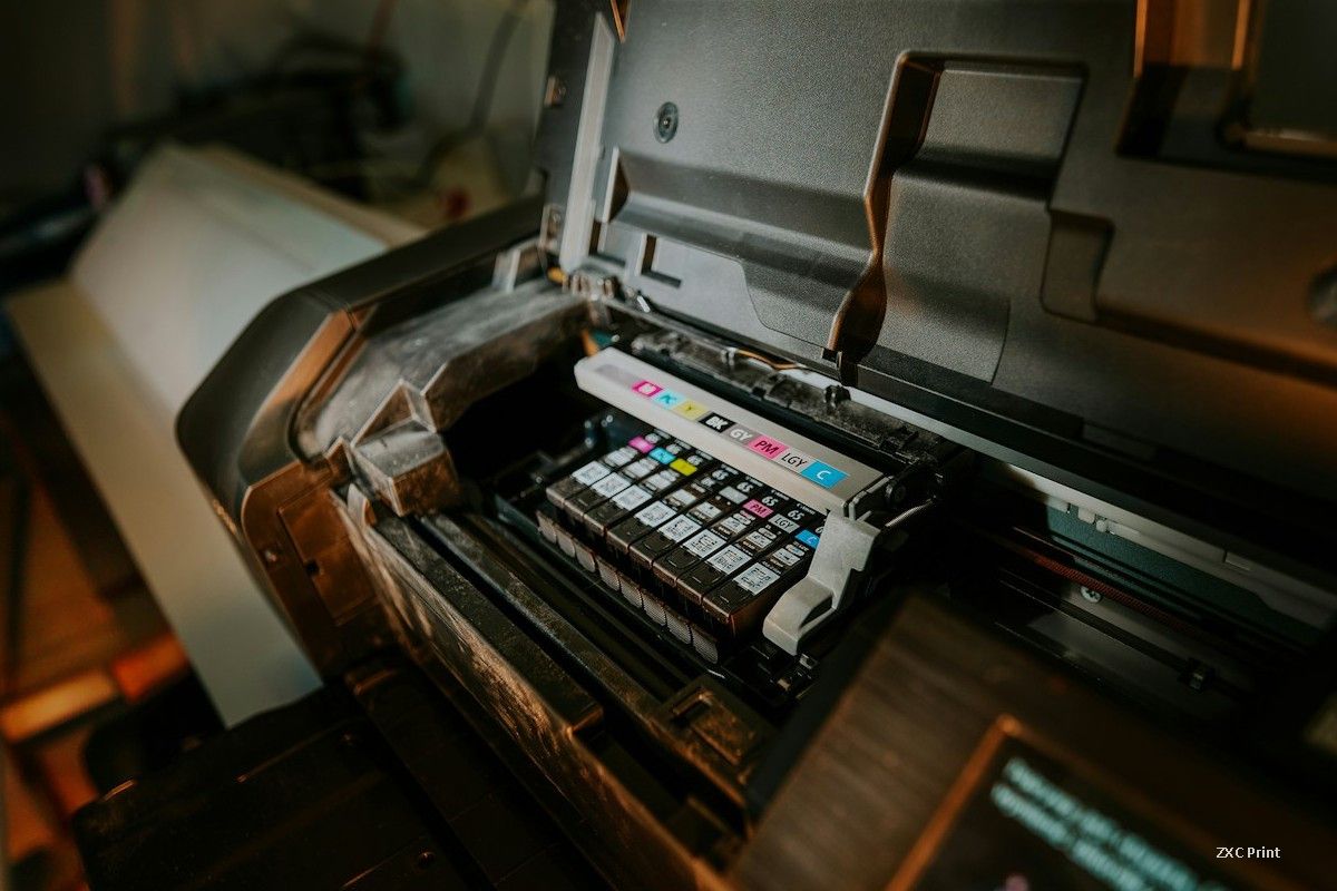 printhead carriage with color ink cartridges inside a modern inkjet printer